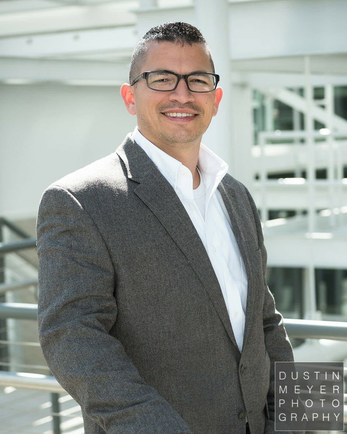 professional headshot tips male business headshot glasses and gray suit outdoors industrial modern contemporary headshots