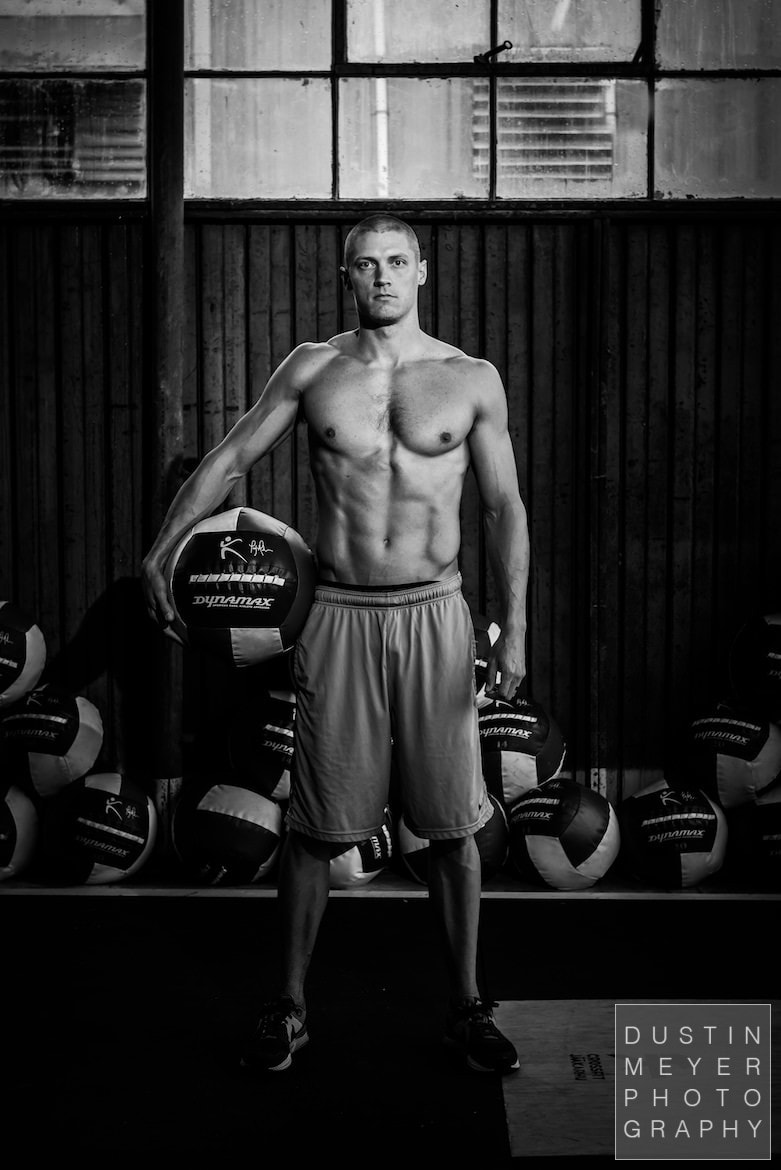 male fitness model in black and white at a crossfit workout